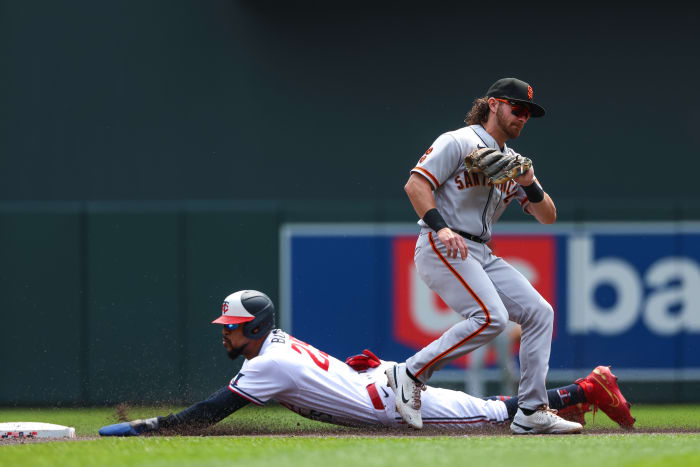 May 24, 2023; Minneapolis, Minnesota, USA; Minnesota Twins designated hitter Byron Buxton (25) steals second base as San Francisco Giants second baseman Brett Wisely (70) fields the ball in the first inning at Target Field.